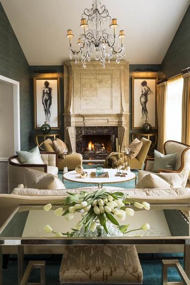 A living room with a fireplace and a chandelier